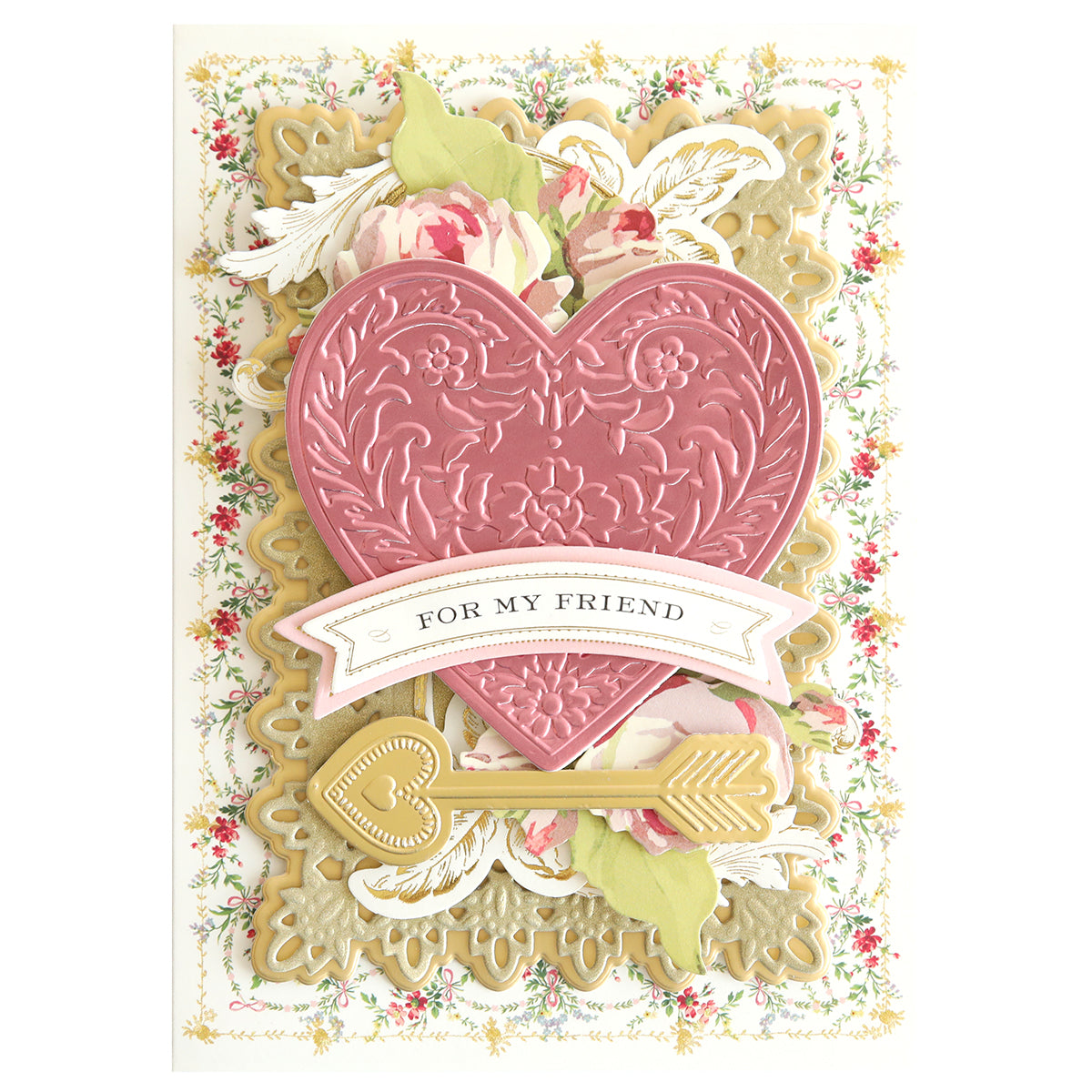 A beautifully designed card showcases a pink embossed heart with arrow decorations, floral motifs, and a gold key. The text "For My Friend" adds a personal touch. Ideal for Valentine's cards, this charming design is brought to life using the Smitten Cut Emboss Folders.