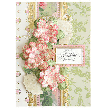 The Posies Flower Mold, Stamps and Dies set creates a decorative birthday card with pink and white flowers, green leaves, gold accents, and a "Happy Birthday to You" message.