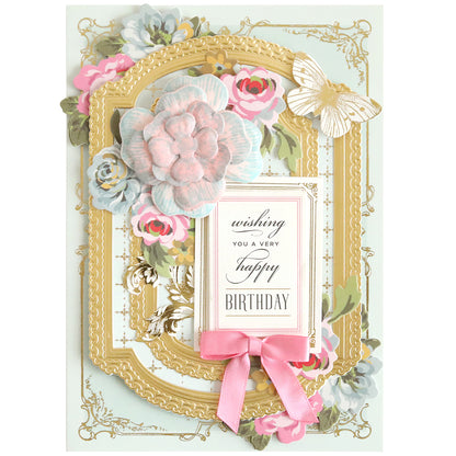 Blossoms Mold, Stamps and Dies create an elegant birthday card adorned with floral and butterfly embellishments, complete with a pink bow and paper flowers, featuring the heartfelt message: 'Wishing You a Very Happy Birthday.'.