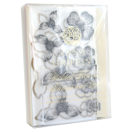 The "Blossoms Mold, Stamps and Dies" comes in a clear packet with floral stencil designs and a gold-embossed "Anna Griffin" label. It's perfect for coordinating with paper flowers to create elegant crafts.