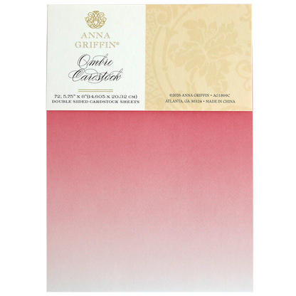 A pack of Ombre Double Sided Cardstock, 5.75" x 8", featuring a pink to white gradient. Ideal for paper crafts, each sheet is premium quality and comes in packaging with branding and product details.