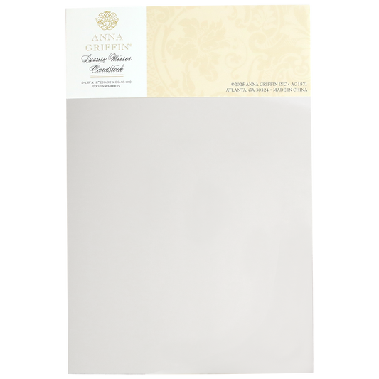 Elegant patterned Luxury Mirror Foil Cardstock with a floral design header featuring subtle embossing. Labeled "Anna Griffin," it includes contact information and states "Made in China.