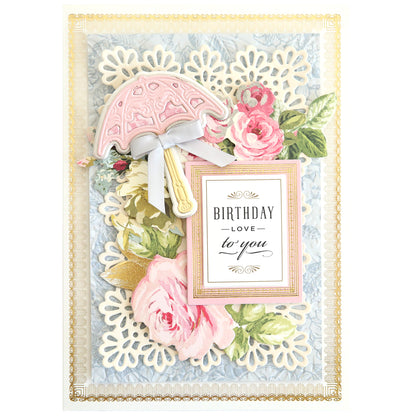 Craft an elegant birthday card with Victorian Umbrella Dies, featuring floral designs, lace patterns, a pink umbrella, and a small frame saying "BIRTHDAY Love to you" for a refined celebration touch.