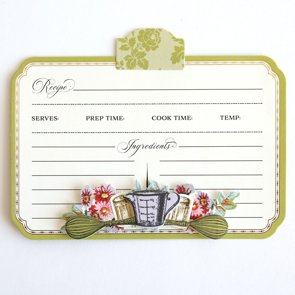 The Recipe Card Stamps, Dies, and Embellishments offer a vintage-style blank recipe card featuring floral and kitchen utensil illustrations with sections for the recipe name, serving size, prep time, cook time, temperature, and ingredients—ideal for adding a personal touch to your culinary collection.