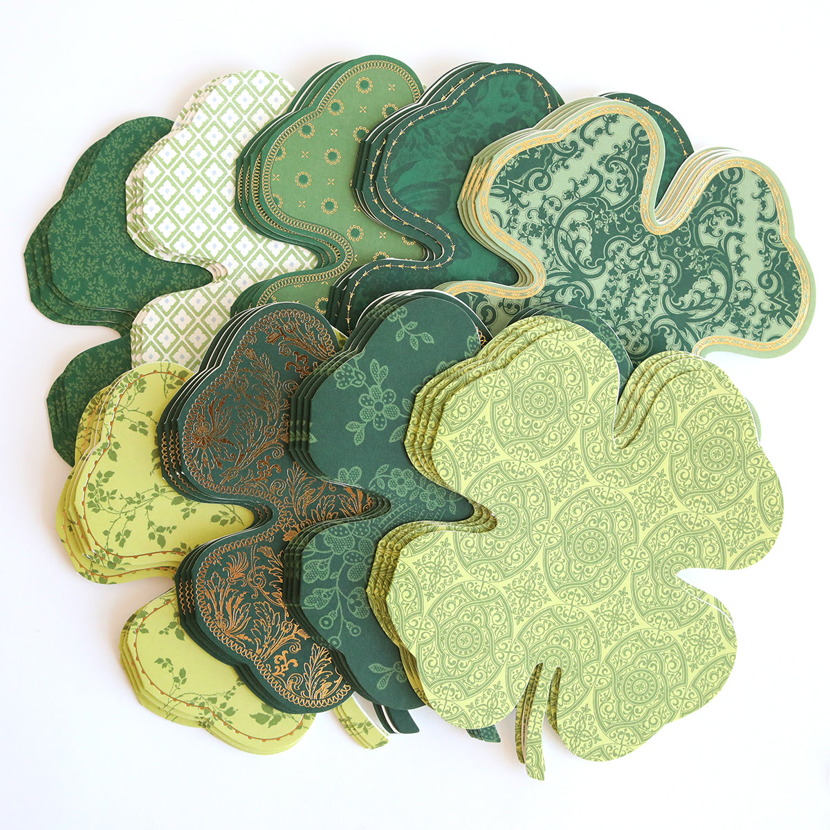 Add a touch of good luck or celebrate St. Patrick's Day with Shamrock Shaped Cards and Envelopes, featuring shamrock-shaped paper cutouts in various shades of green and assorted patterns.