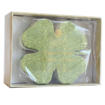 Shamrock-shaped cards and envelopes come beautifully packaged in a transparent box with a beige border, adding St. Patrick's Day charm and good luck to any table setting.