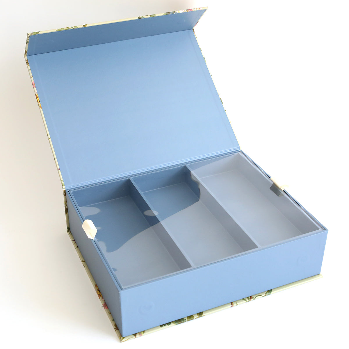 The Francesca Craft Storage box features a floral pattern, blue interior, and three compartments, making it ideal for organizing embellishments and die storage.