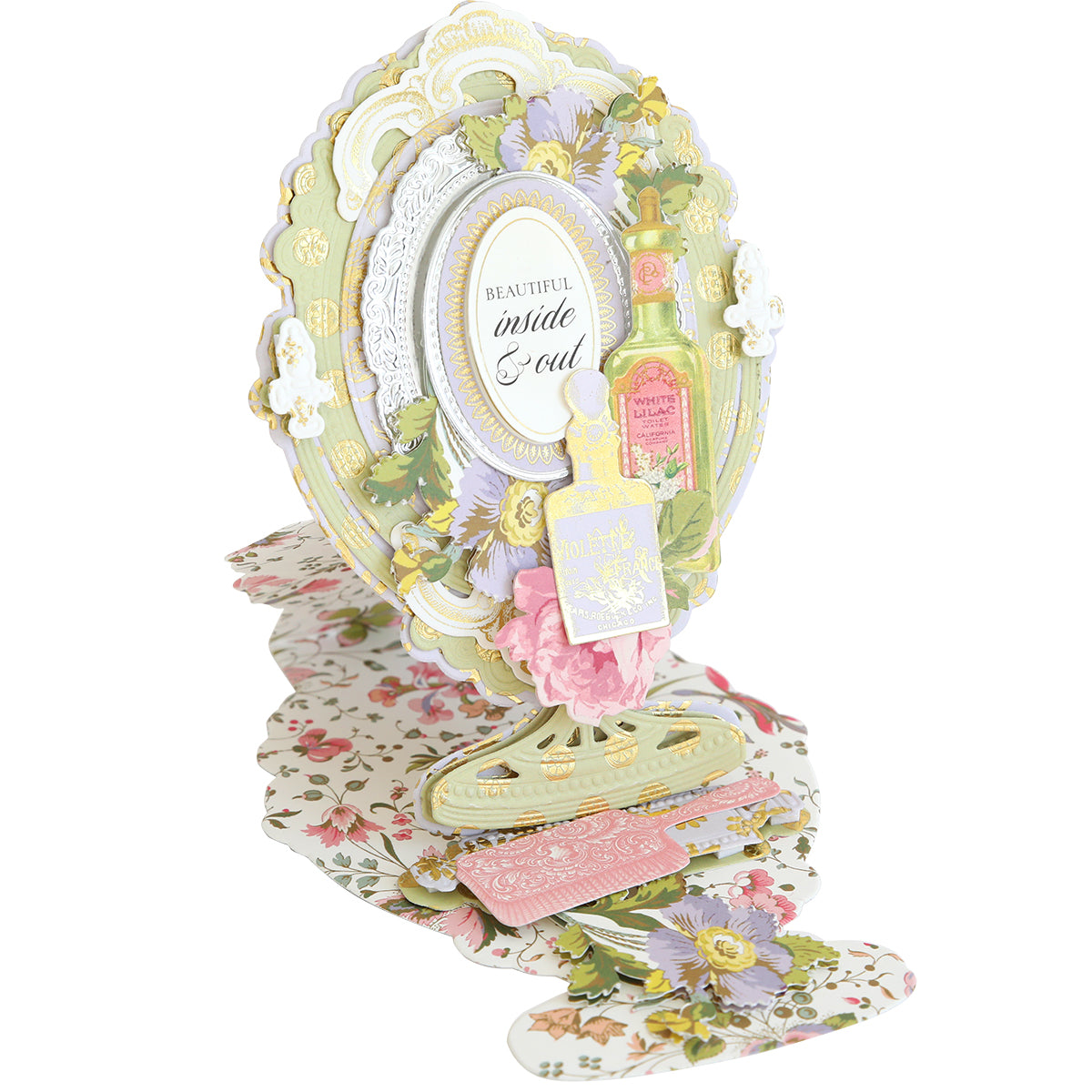 The Mirror Card Craft Box contains an ornate floral pop-up card made from double-sided cardstock, featuring flowers, a perfume bottle, and "Beautiful inside & out" text. The floral-patterned base includes exquisite foil embellishment stickers for added elegance.