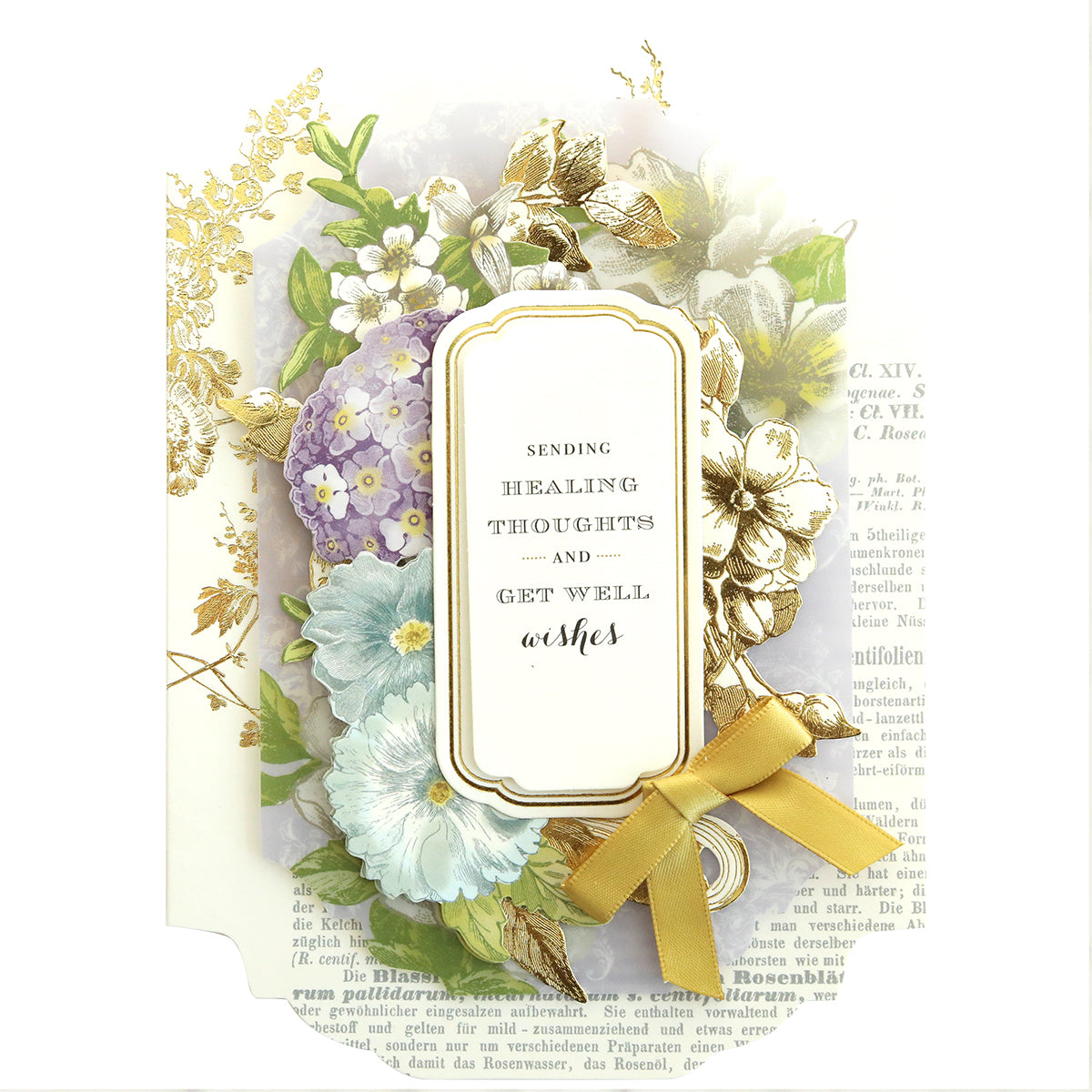 The Simply Get Well Card Making Kit offers a floral-themed card with "Sending healing thoughts and get well wishes" on the front, adorned with 3D embellishments, a gold bow, and decorative flowers—perfect for conveying your warmest wishes.