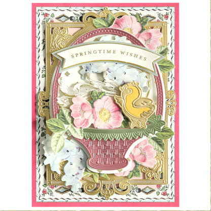 The "Easter Scene Dies" features a decorative card with "Springtime Wishes," showcasing flowers, an Easter basket, and a yellow bird on an ornate background—ideal for crafting enthusiasts.