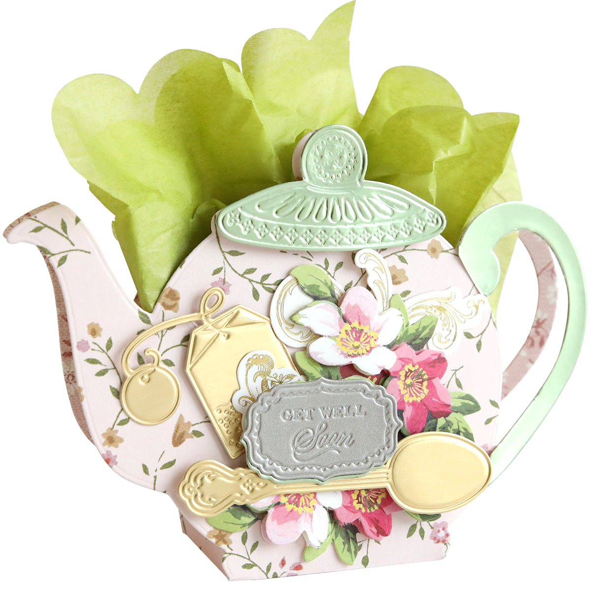 A "Get Well Soon" card featuring the Teapot Box Dies design, adorned with floral patterns and containing green tissue paper.