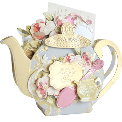 The Teapot Box Dies create a greeting card shaped like a teapot, featuring floral designs, a lid, tea bag, and small cup. The sweet message "You are my cup of tea" makes it perfect for any occasion.