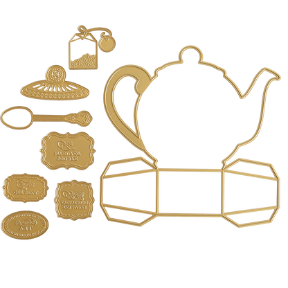 The Teapot Box Dies set includes gold metal dies in the shape of a teapot, cup, spoon, saucer, and decorative labels with embossed text like "Tea Time" and "Take a Break." Ideal for crafting teapot boxes or presenting delightful treats.