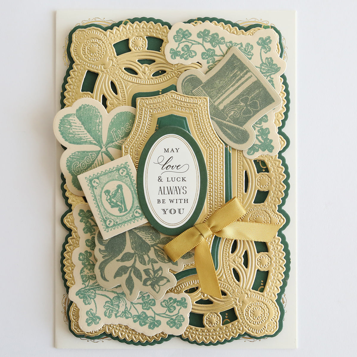 Ornate greeting card with intricate gold and green designs using Lucky Palette Hybrid Inks, featuring a bow, floral and clover motifs, highlighted with metallic accents, and the message "May Love & Luck Always Be With You.