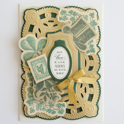 Ornate greeting card with intricate gold and green designs using Lucky Palette Hybrid Inks, featuring a bow, floral and clover motifs, highlighted with metallic accents, and the message "May Love & Luck Always Be With You.