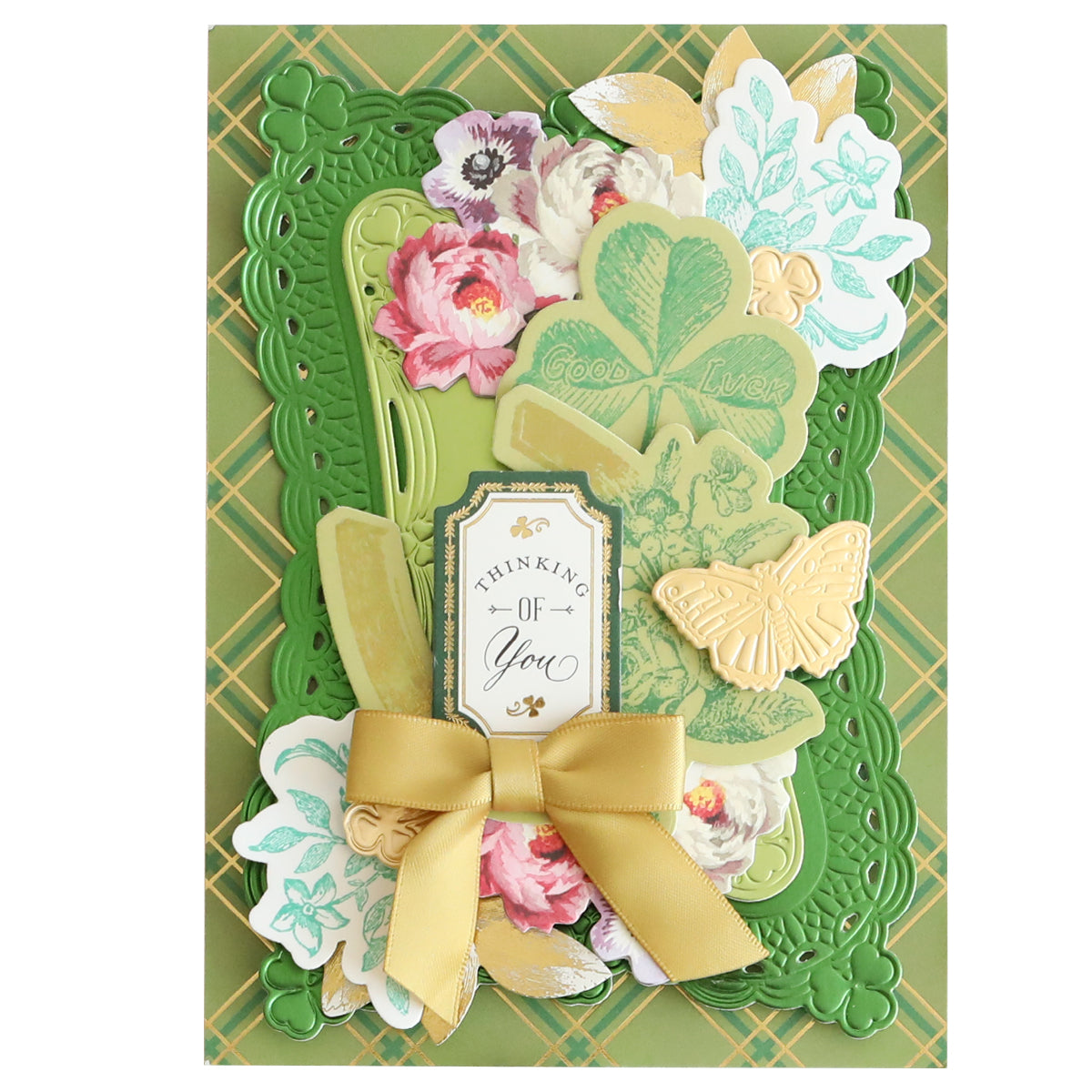 A decorative "Thinking of You" card featuring floral and butterfly accents, clovers, and a gold bow on a green patterned background uses Lucky Palette Hybrid Inks for vibrant details and an added touch of charm.