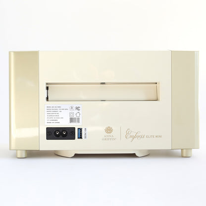 Back view of the Empress Elite Mini Machine with 13" Plates, showing the power switch, power port, and product information label.