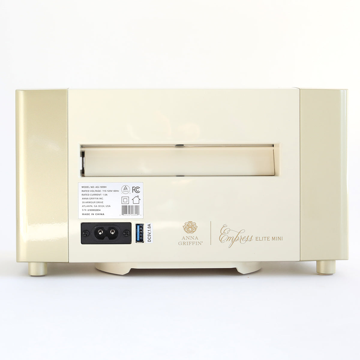 Back view of the Empress Elite Mini Diecutting and Embossing Machine, showing the power switch, input port, and model information label.