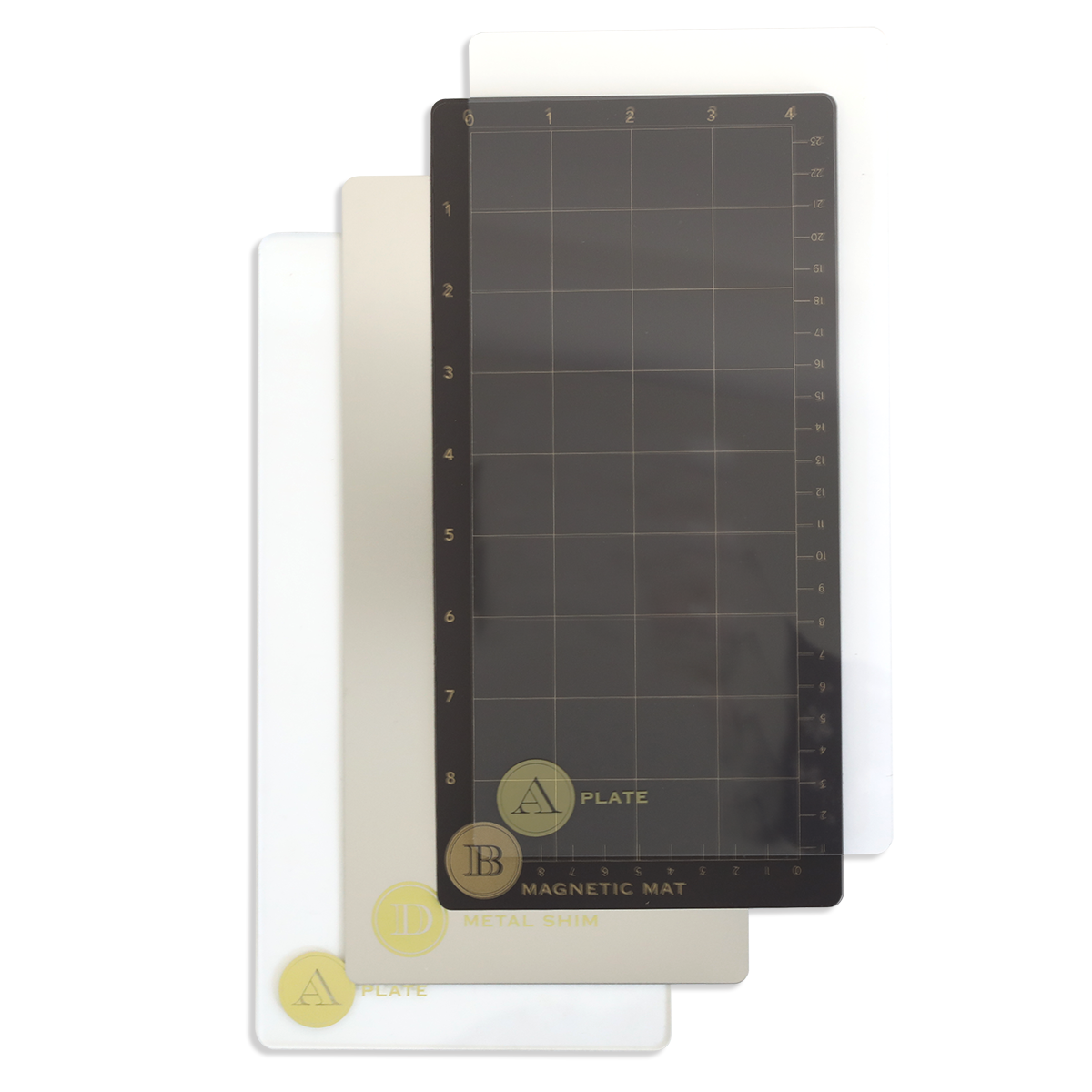Three rectangular plates—a 5" x 10", a 13", and a magnetic grid mat—are fanned out on white, perfect accessories for your Empress Elite Mini Machine with 5" x 10" and 13" plates.