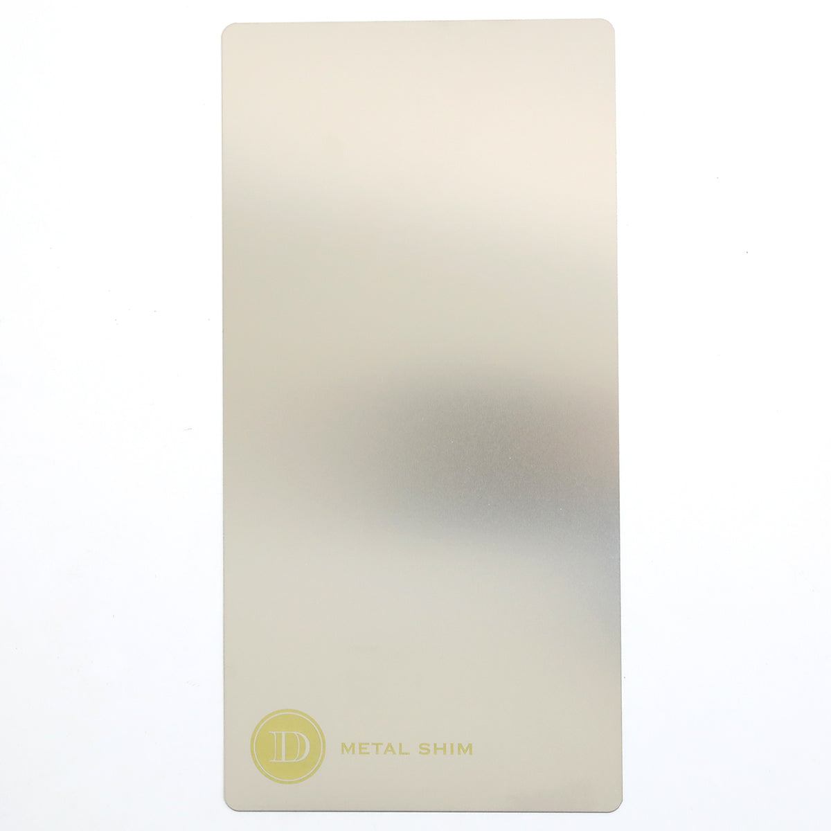 A rectangular, silver metal shim with rounded corners for the Empress Elite Mini 5" x 10" Full Plate Set. Features a small yellow logo and "METAL SHIM" printed at the bottom left corner.
