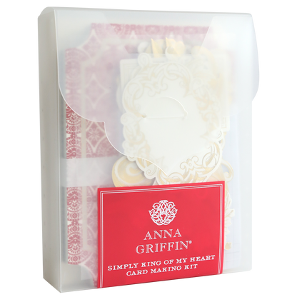 A translucent plastic case contains the Simply King of My Heart Card Making Kit, showcasing 3D embellishments and decorative materials for crafting beautiful handmade cards.