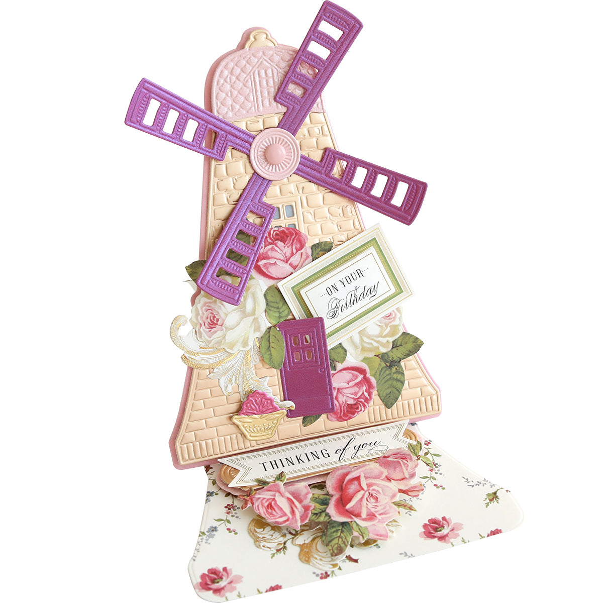 The 3D Windmill Easel Dies create a pop-up card showcasing a windmill with purple blades, adorned by floral designs and messages like "On Your Birthday" and "Thinking of You.