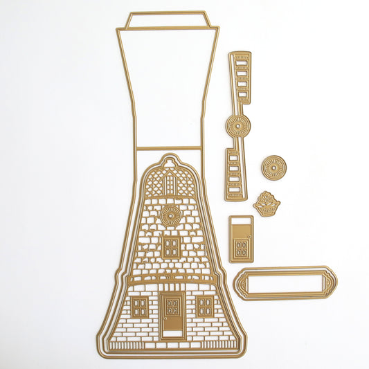 Gold outline of a lighthouse featuring embossed elements, with additional separate fence, wheel, window, shrub, and plaque shapes on a white background. Product: 3D Windmill Easel Dies.