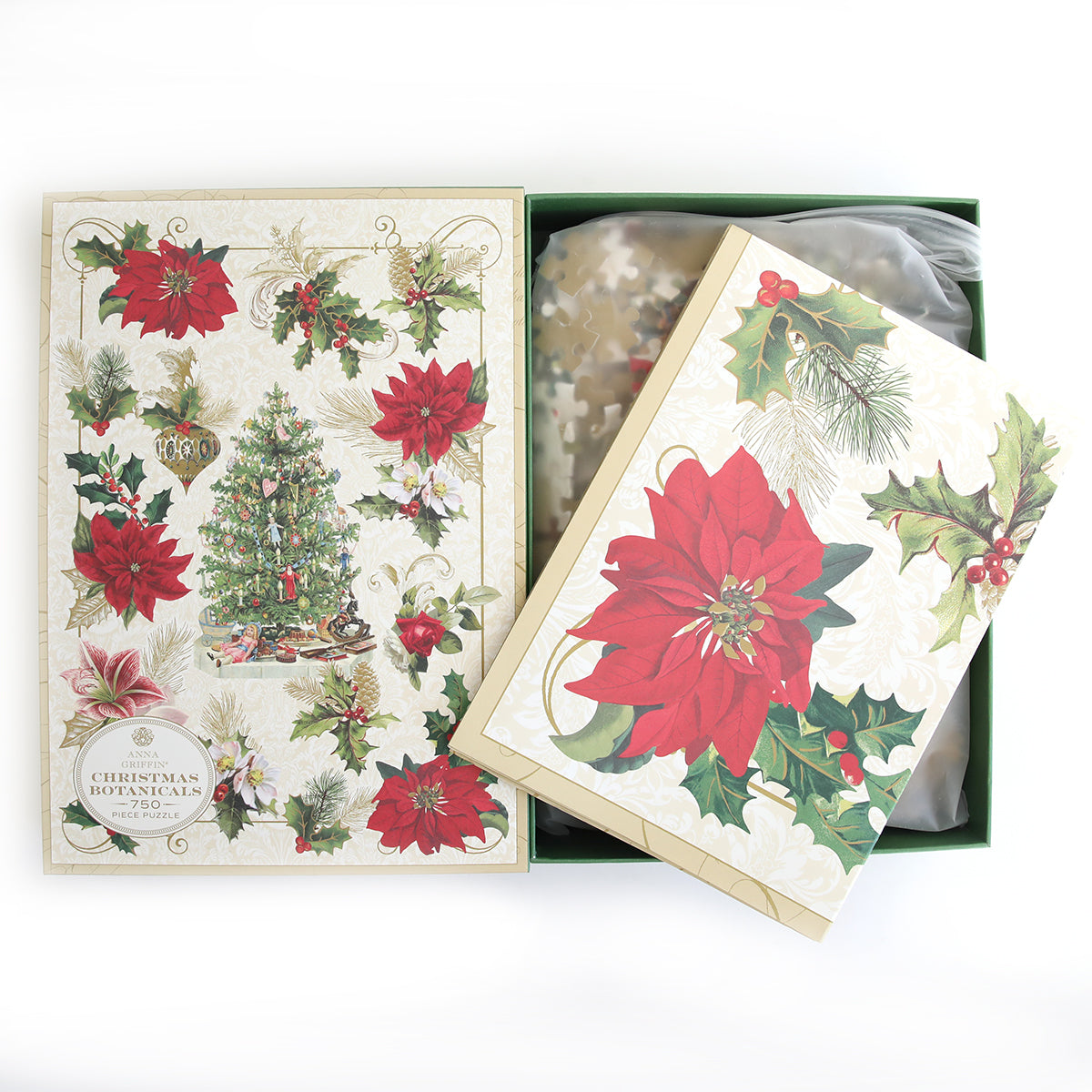 The Christmas Botanicals Jigsaw Puzzle box displays festive poinsettias and a decorated tree, and opening it reveals vibrant holiday puzzle pieces inside.