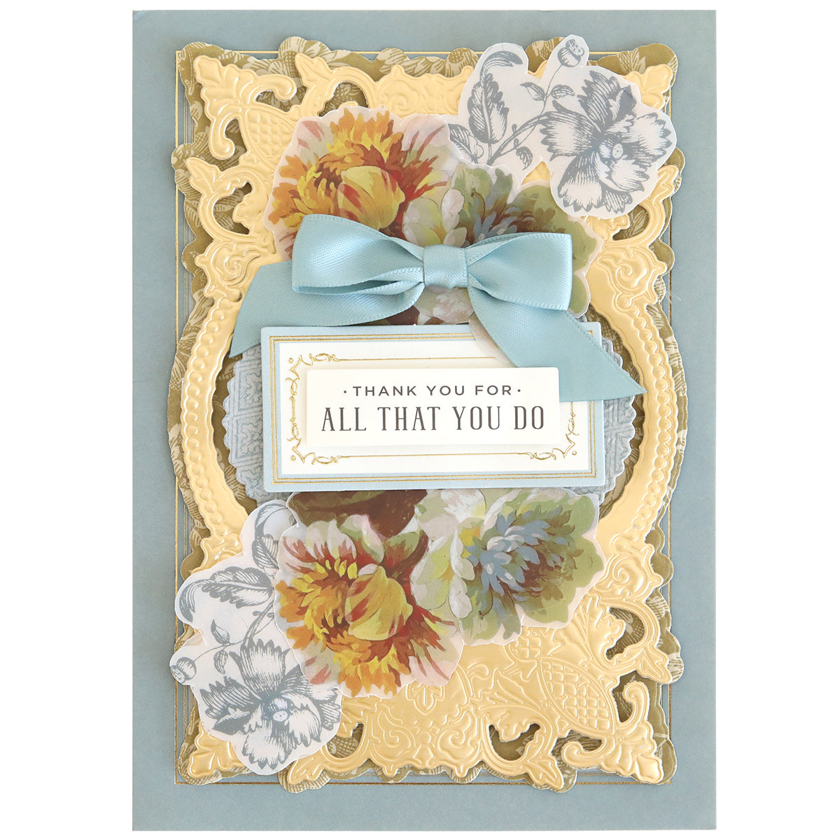 Decorative card featuring gold accents, floral designs made with rub on transfers, a blue ribbon, and a central plaque that reads “Thank you for all that you do”—an ideal addition to your scrapbook supplies or the Ultimate Francesca Papercrafting Collection with Rub Ons.