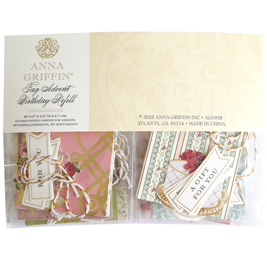 A package of Tag Advent Birthday Refill, featuring assorted cardstocks, scrapbook tags, and pink and cream embellishments—ideal for card making and DIY crafts.
