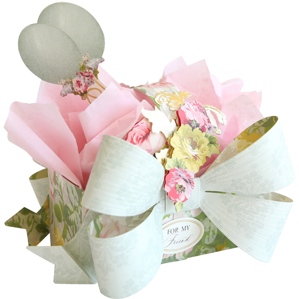 The Bow Box Dies create a floral treat box with a large white bow, pink tissue paper, flower accents, two mesh balloons, and a "For My Friend" tag—perfect for making memorable gift boxes.