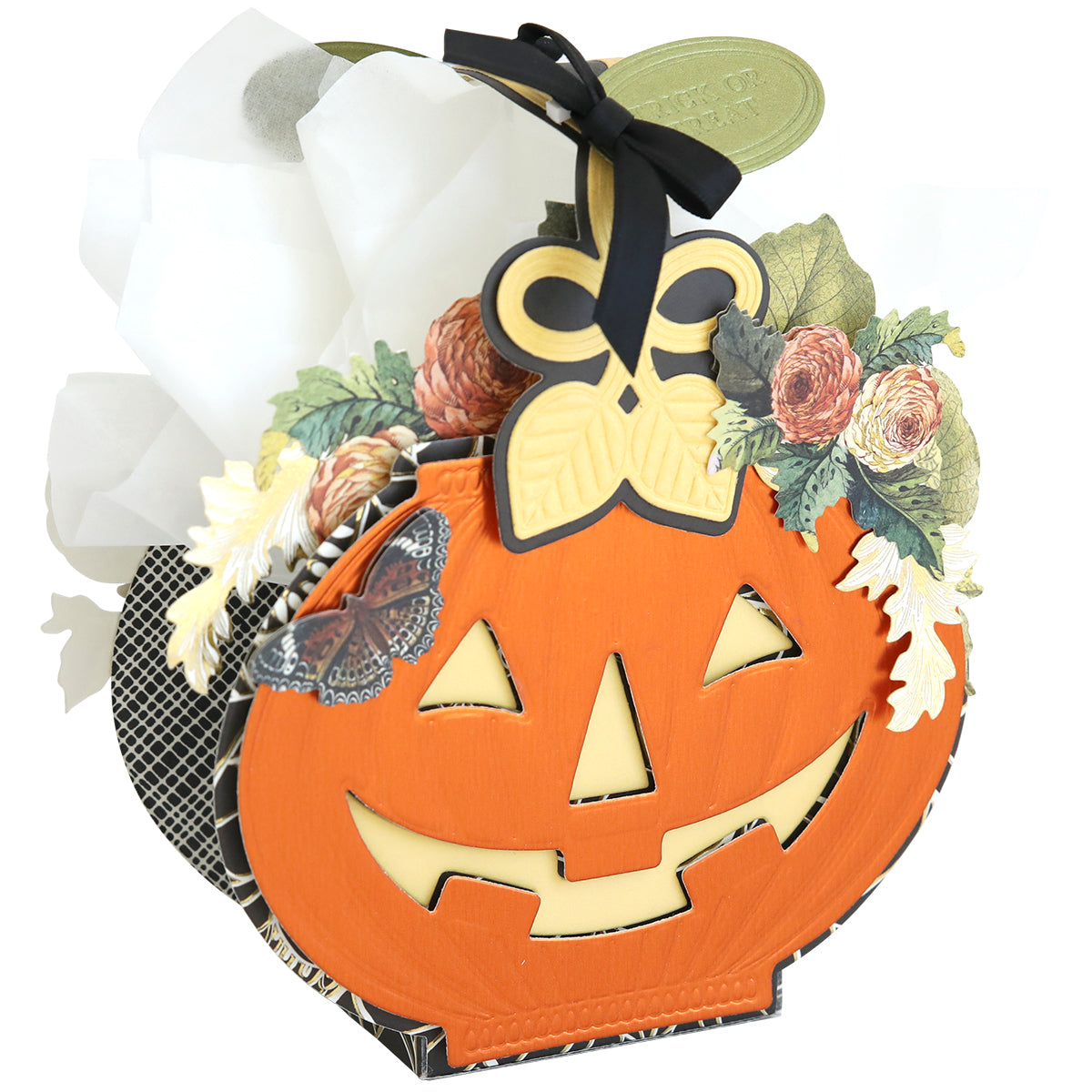 A festive pumpkin-shaped gift bag featuring a smiling face, floral and butterfly accents, and white tissue—perfect for displaying your Halloween craft or pairing with Halloween Box Dies.