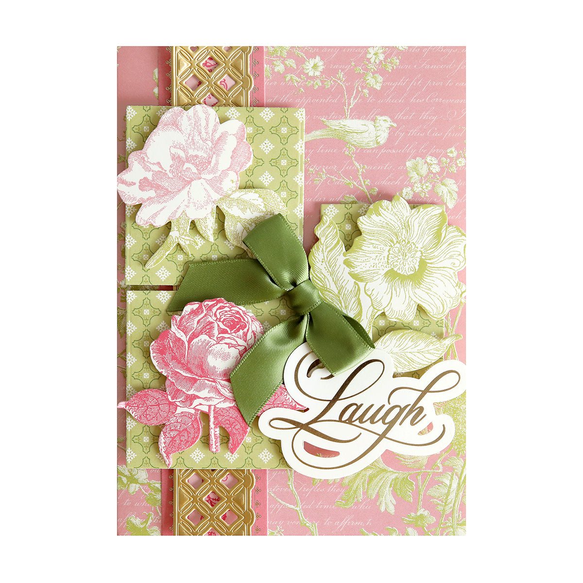 A decorative greeting card from the Beautiful Botanical Bundle, crafted with layered card-making techniques and embellished with pink, green, and gold floral designs, a green ribbon bow, and the word “Laugh” elegantly scripted on the front.