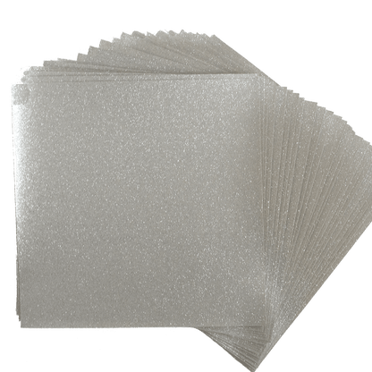 A stack of white glitter sheets on a white background.