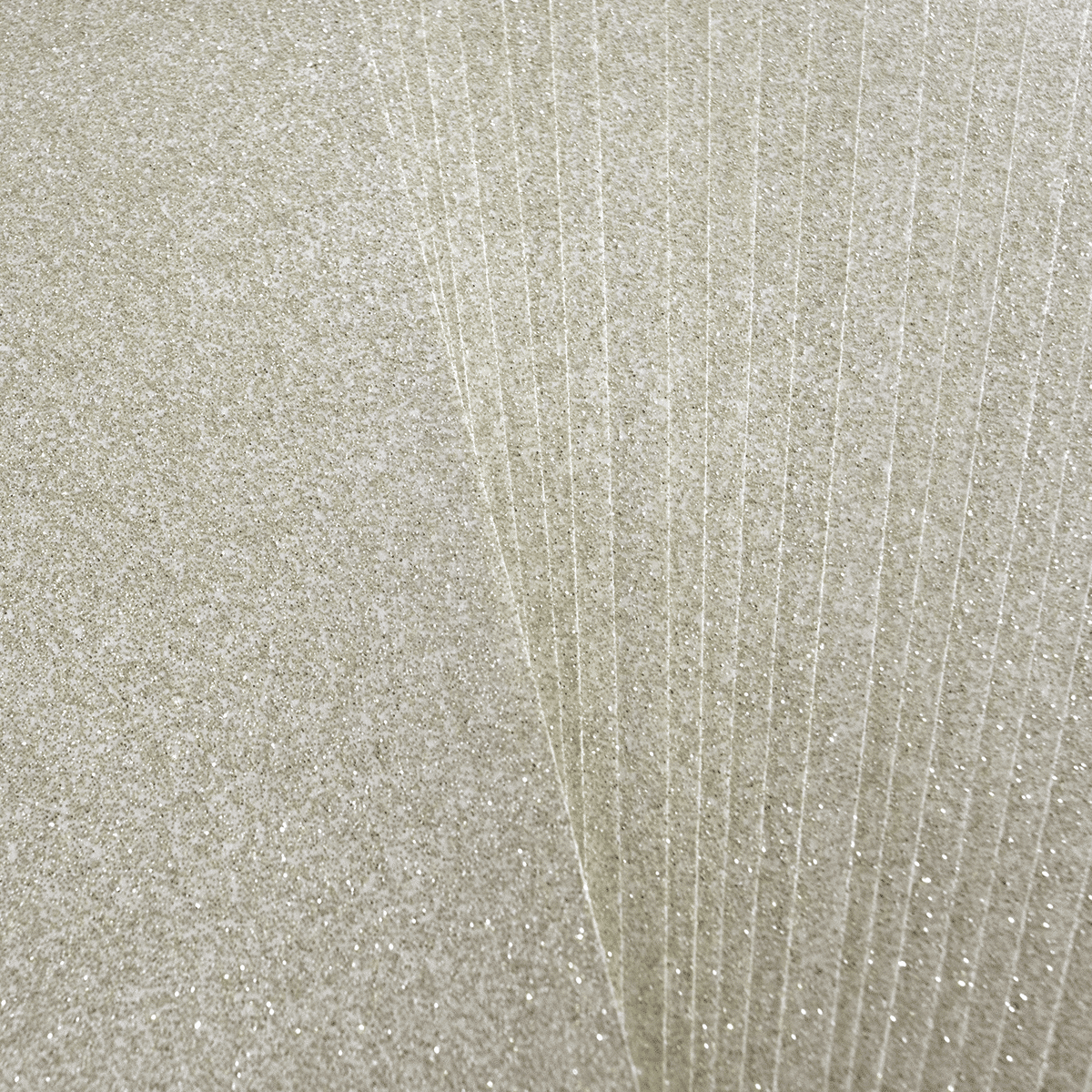A close up of a sheet of white glitter paper.