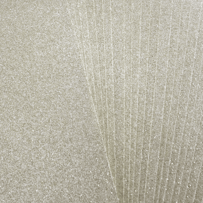A close up of a sheet of white glitter paper.