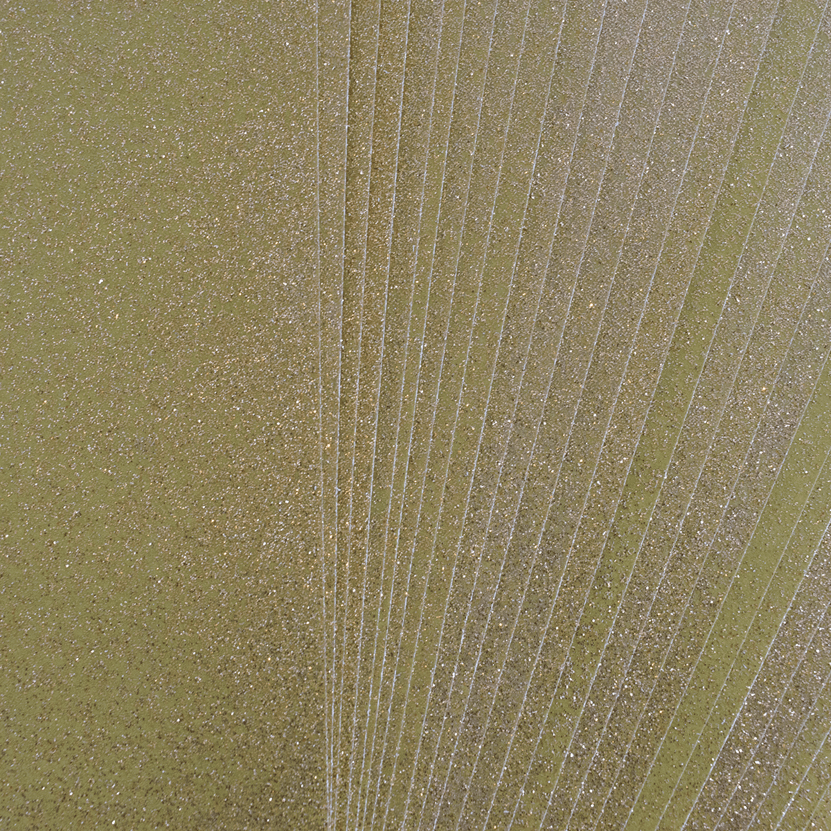 A close up of a green sheet of paper.