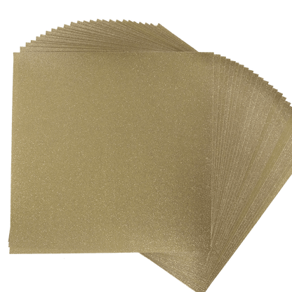 A stack of gold glitter sheets on a white background.