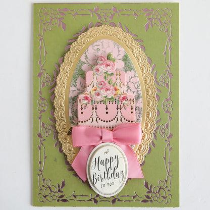 A decorative birthday card featuring a pink cake, florals, gold frame, bow, and an oval "Happy Birthday to You" label—crafted with Color Drenched Cardstock Sage Green—perfect for handmade card making enthusiasts.