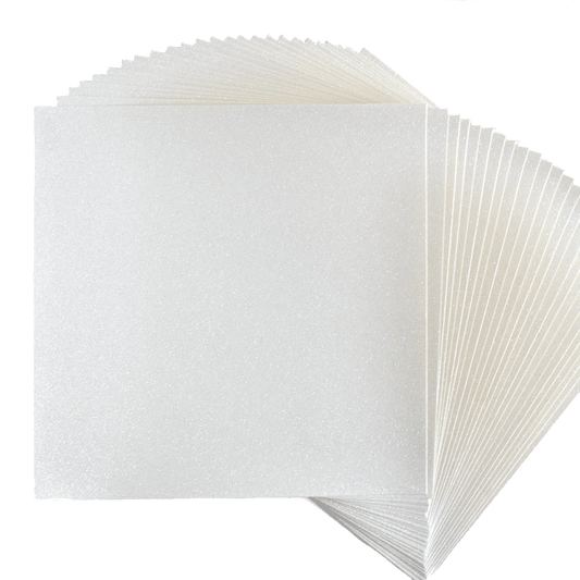 A stack of white paper squares on a white background.