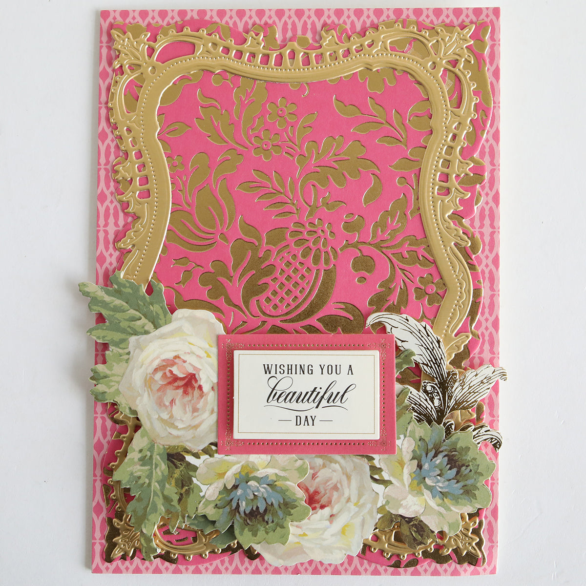A decorative greeting card featuring a gold floral frame, pink background, and "Wishing you a beautiful day" label—perfect for card making with Color Drenched Cardstock Peony Pink.