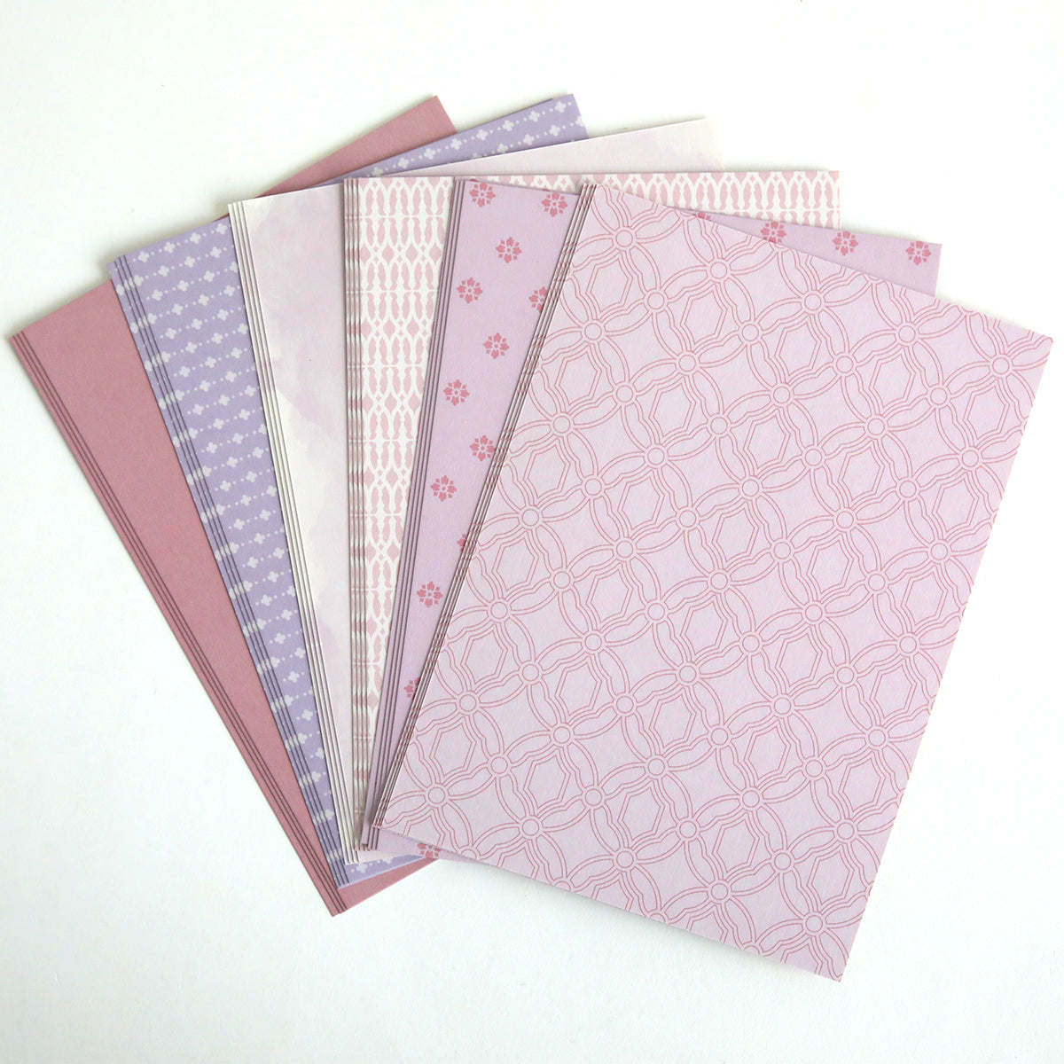 Color Drenched Cardstock Fresh Lilac sheets in pink and purple, fanned out on a white background—ideal for card making or pairing with hot foil plates for added shine.