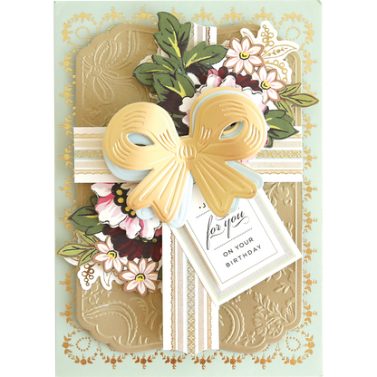 Create a stunning birthday card with Bow Cut & Emboss Folders—features embossed gold, paper bows, floral accents, and a "for you on your birthday" tag. Perfect for adding handmade flair to your next craft project!.