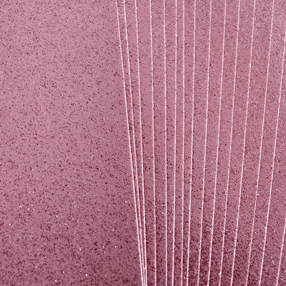 A close up of a pink wall.