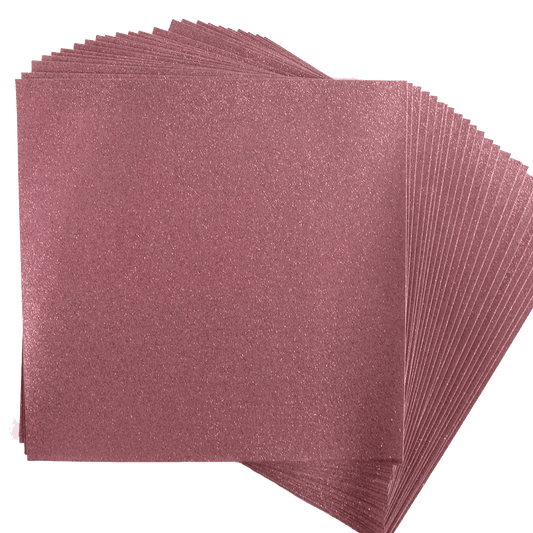 A stack of pink sanding sheets on a white background.