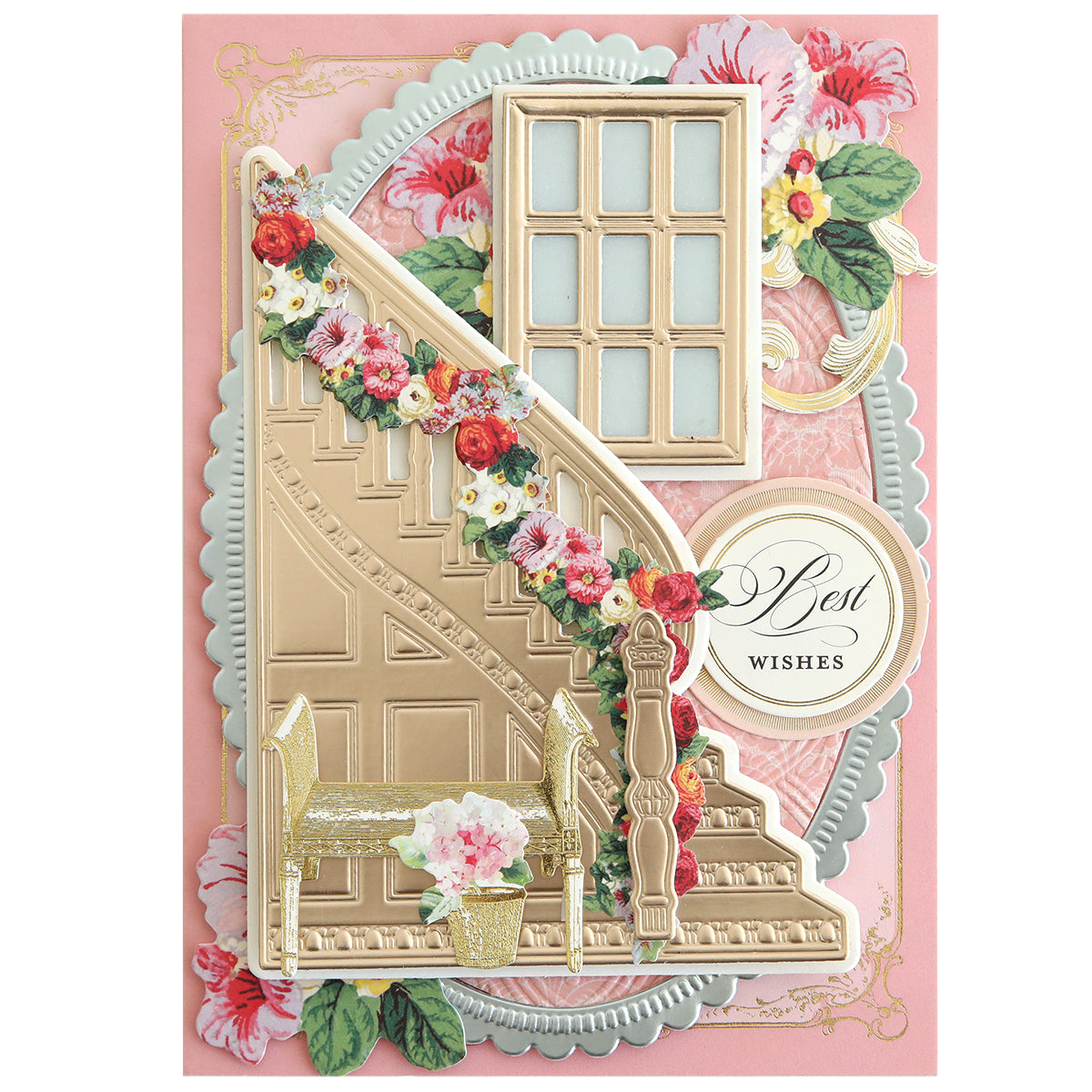 A decorative greeting card showcasing Grand Staircase Dies with a gold staircase, flower garland, window, bench with potted plant, and a "Best Wishes" message on a pink floral background—ideal for creative card making.