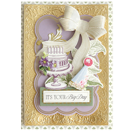 The Birthday Present Card Making Kit includes supplies to create a decorative card with a layered cake, flowers, a large bow, and "IT'S YOUR Big Day" on an ornate gold and lavender background—perfect for handmade birthday card inspiration.