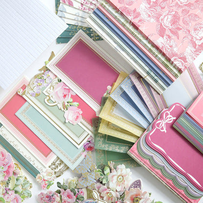 The Birthday Present Card Making Kit includes assorted decorative paper sheets, envelopes, and floral-themed stationery—perfect supplies for crafting handmade birthday cards or creating a unique gift.