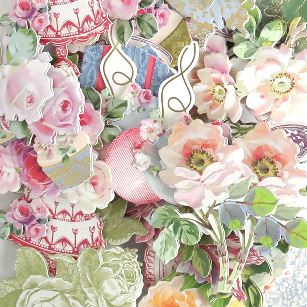 A collage of vintage-style floral cutouts featuring roses, peonies, teacups, leaves, and gold decorative accents arranged in a dense, overlapping pattern—perfect for adding a charming touch to handmade birthday cards or your Birthday Present Card Making Kit.
