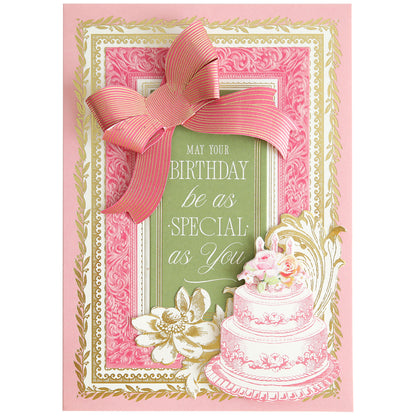 A decorative birthday card included in the Birthday Present Card Making Kit, featuring a pink ribbon, gold floral accents, and the heartfelt message "May your birthday be as special as you," complemented by a charming cake illustration—ideal for inspiring handmade cards or adding a unique touch to your next project.